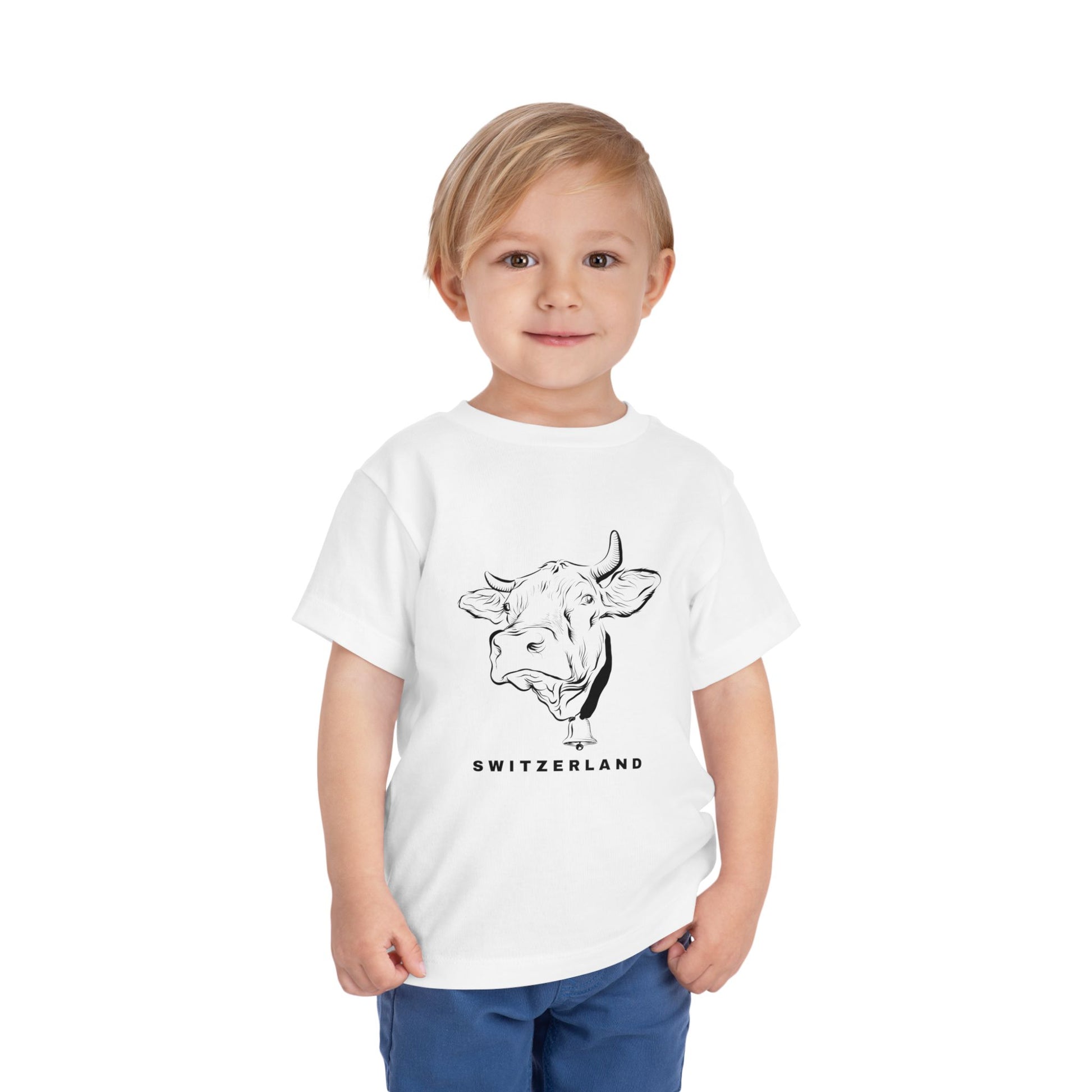 Toddler boy smiling in Alpine-themed Switzerland souvenir t-shirt