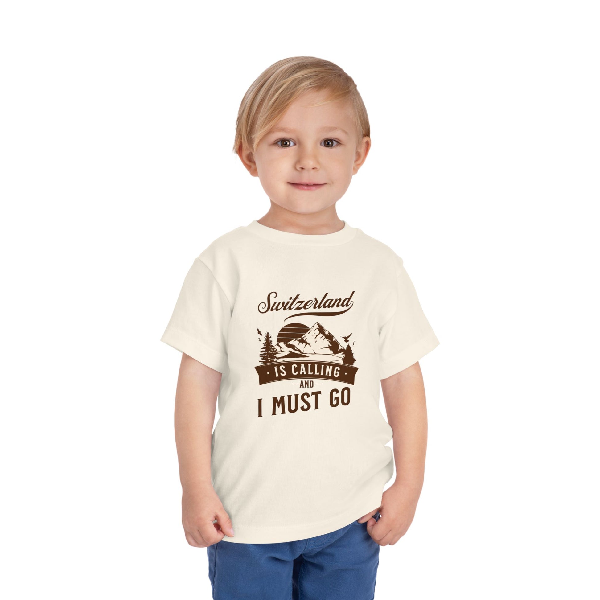 Little boy modeling Switzerland slogan t-shirt with playful and adventurous style