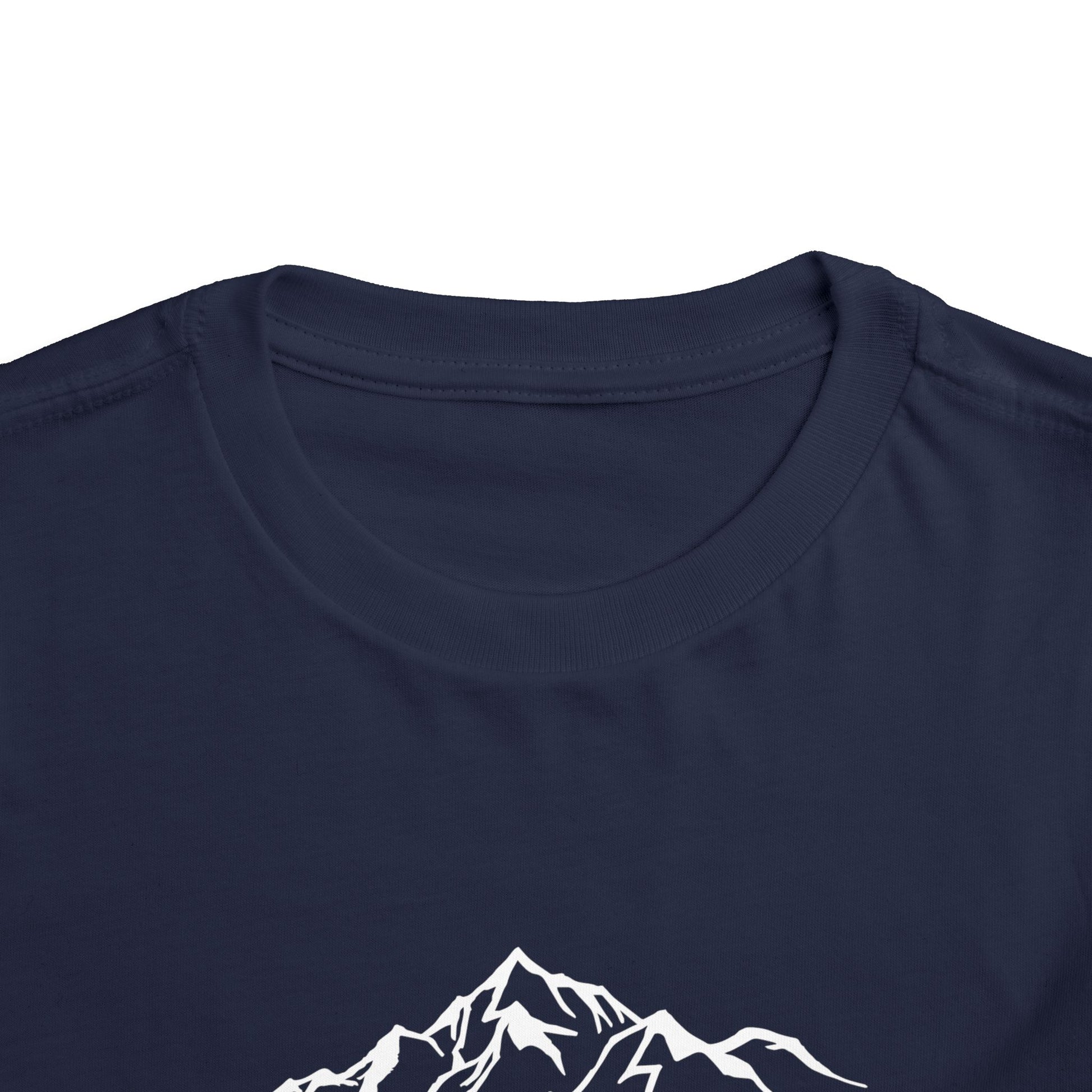 Flat lay of pink Lauterbrunnen toddler tee with mountain graphic