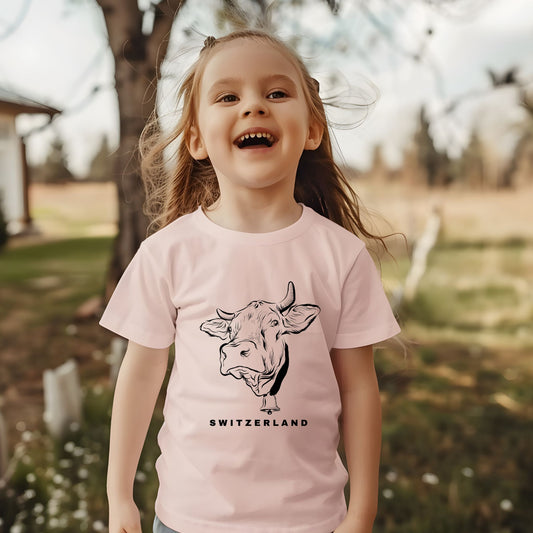 Happy toddler wearing a Switzerland cow t-shirt outdoors