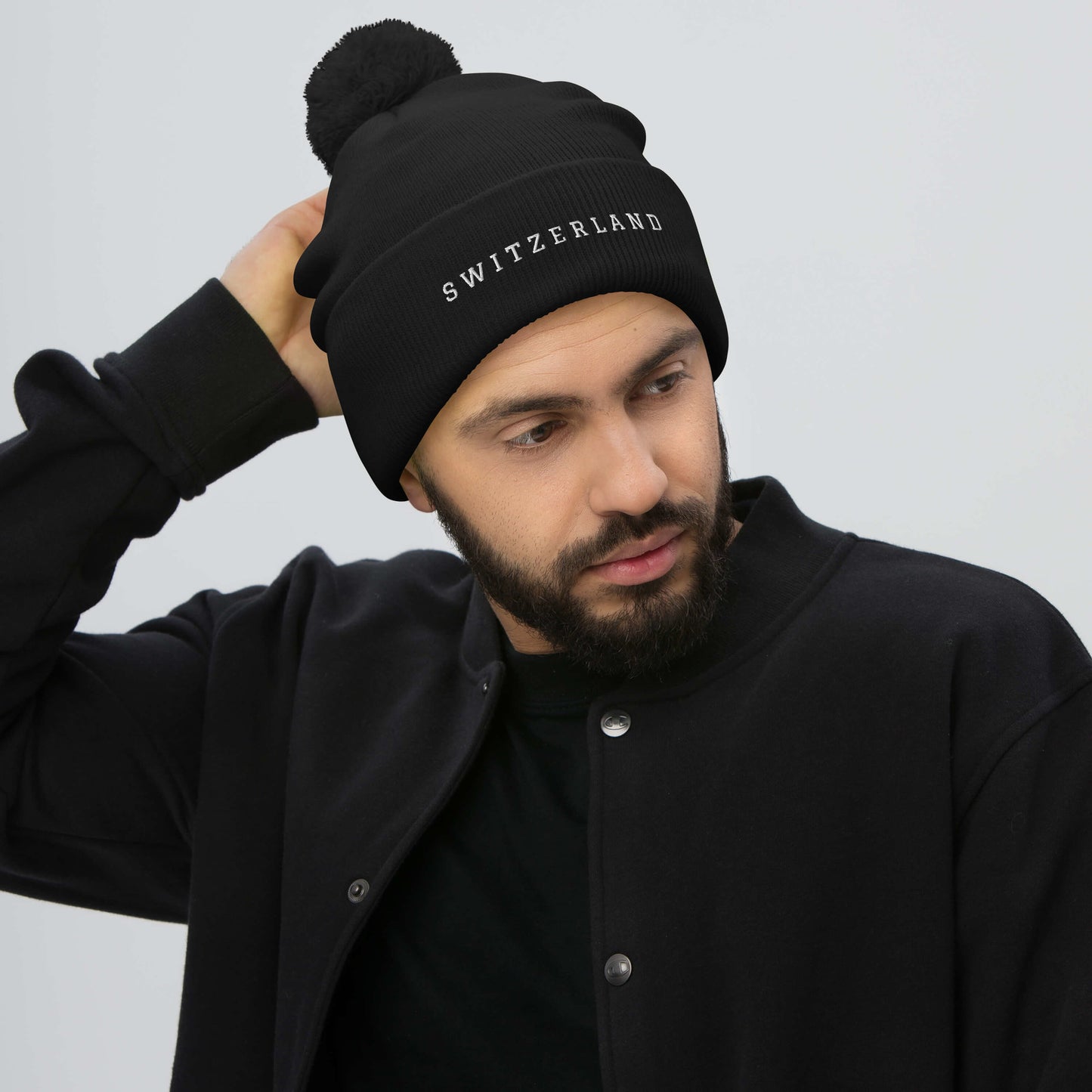 Switzerland Pom-Pom Beanie in Black with Embroidered Text