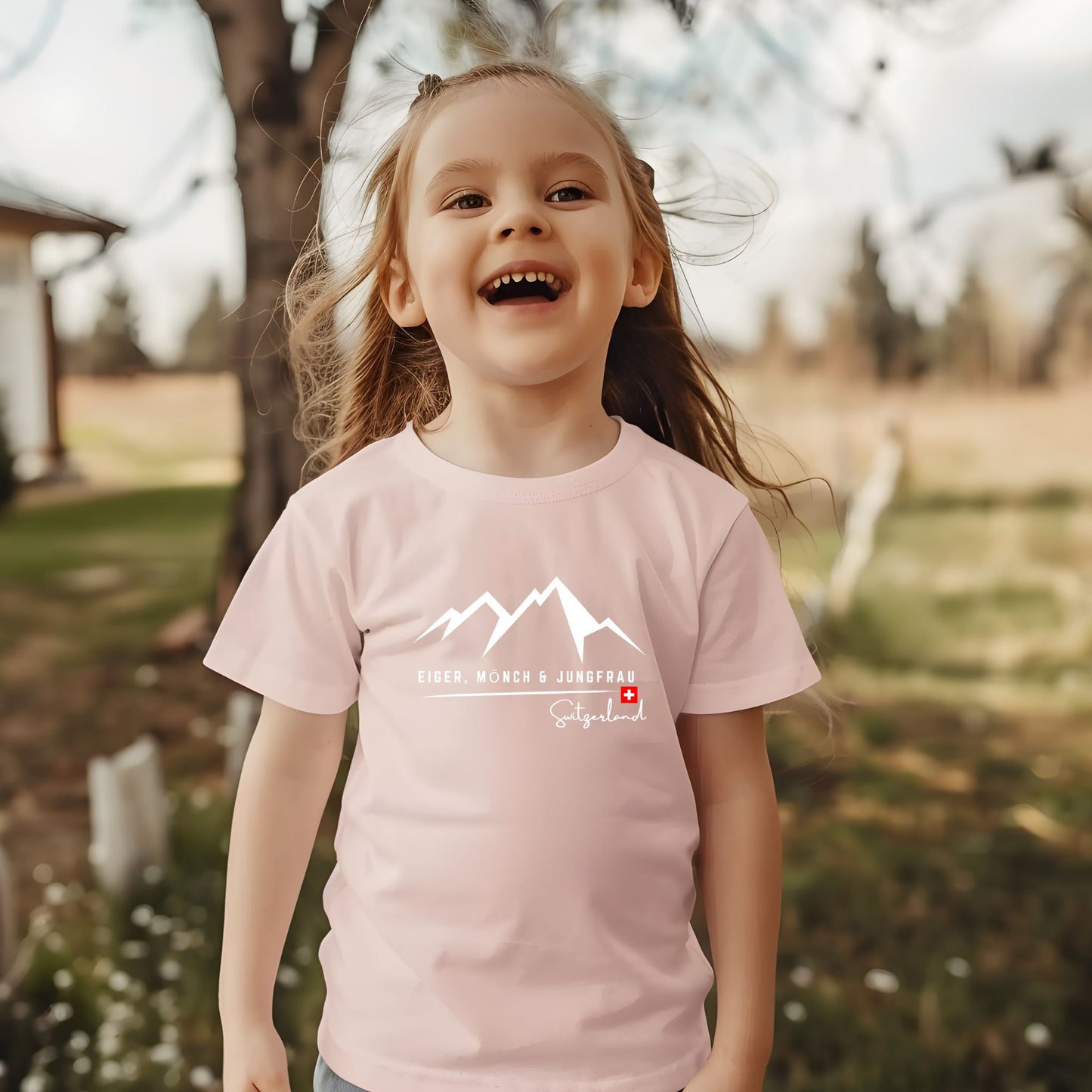 Toddler wearing Eiger Mönch Jungfrau Switzerland mountain t-shirt in pink