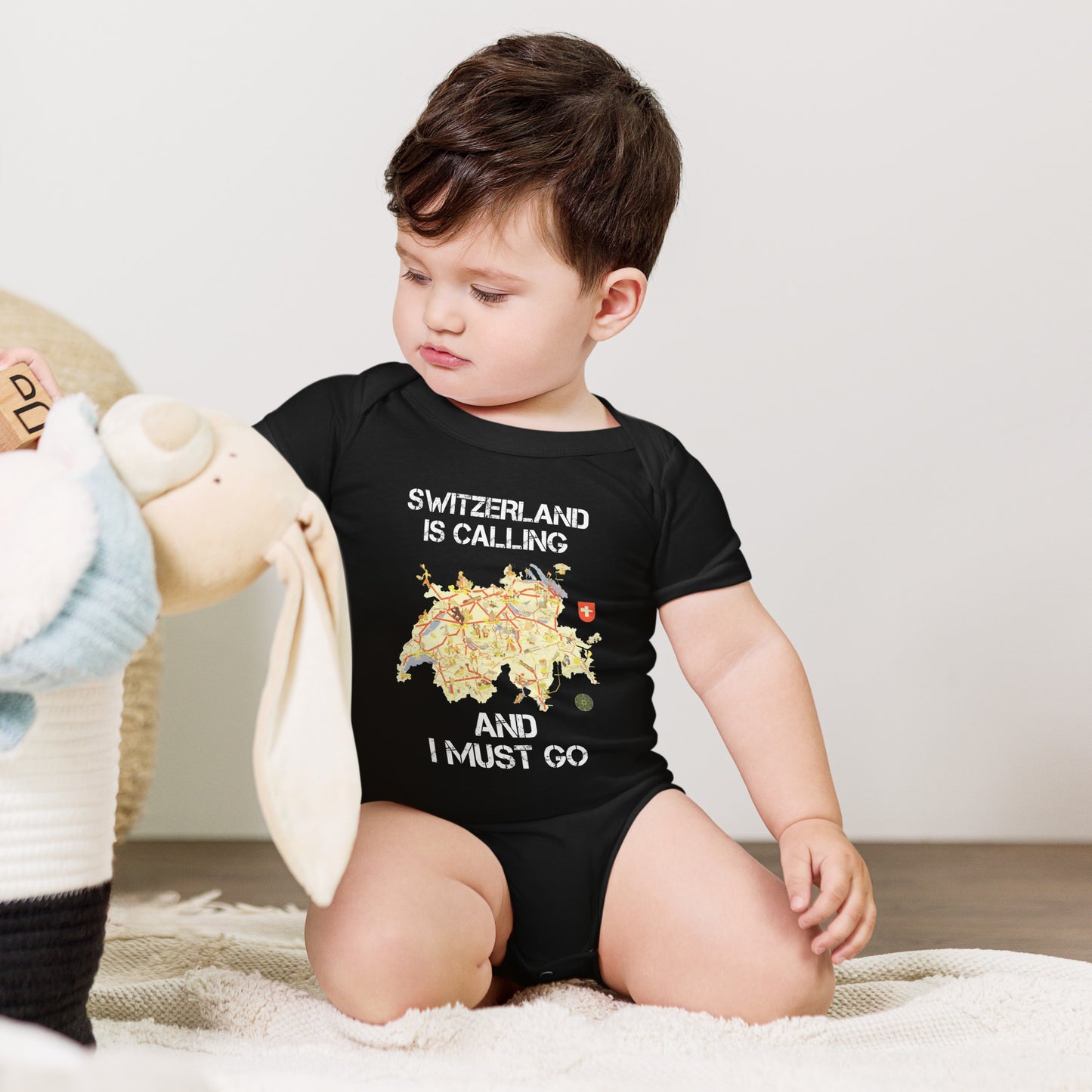 Switzerland is calling baby bodysuit – front view in black