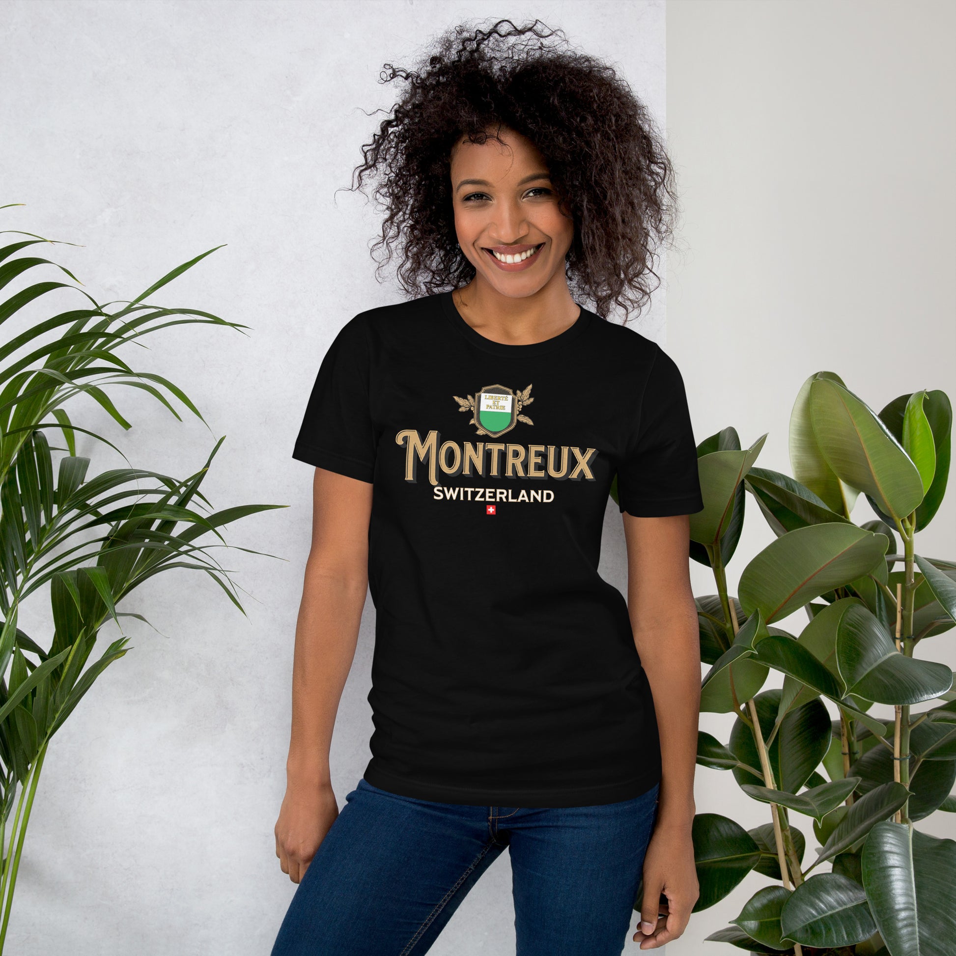 Woman wearing black Montreux Switzerland vintage crest t-shirt, casual outfit.