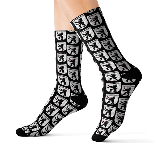 A pair of sublimation socks with the Appenzell coat of arms design, showcasing intricate details in vibrant colors