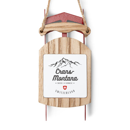 Crans-Montana Switzerland sled ornament with mountain design and Swiss cross for Christmas tree décor