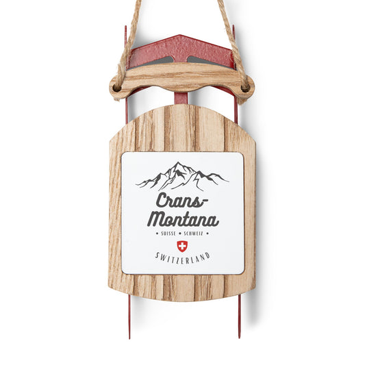 Crans-Montana Switzerland sled ornament with mountain design and Swiss cross for Christmas tree décor