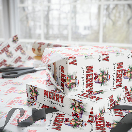 A roll of Merry Swissmas Wrapping Paper featuring festive Swiss cows on a gift box