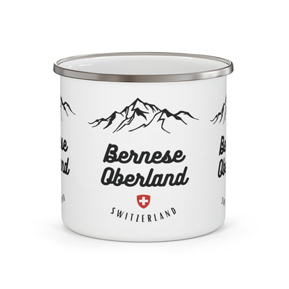 White enamel mug with mountain design and 'Bernese Oberland Switzerland' text on a white background
