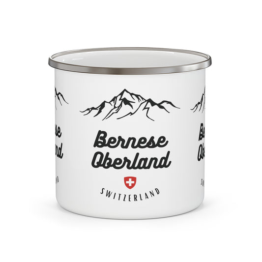 White enamel mug with mountain design and 'Bernese Oberland Switzerland' text on a white background