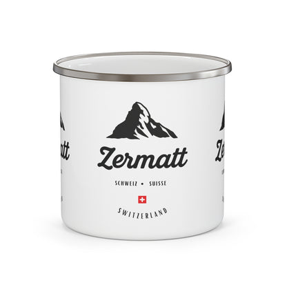 White enamel mug with Zermatt branding and mountain graphic 
