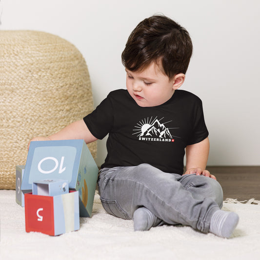 Baby wearing black Switzerland t-shirt with minimalist Alps design