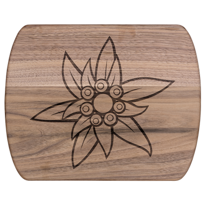 Premium dark wood Swiss cutting board with laser-engraved Edelweiss flower design and handle for kitchen use