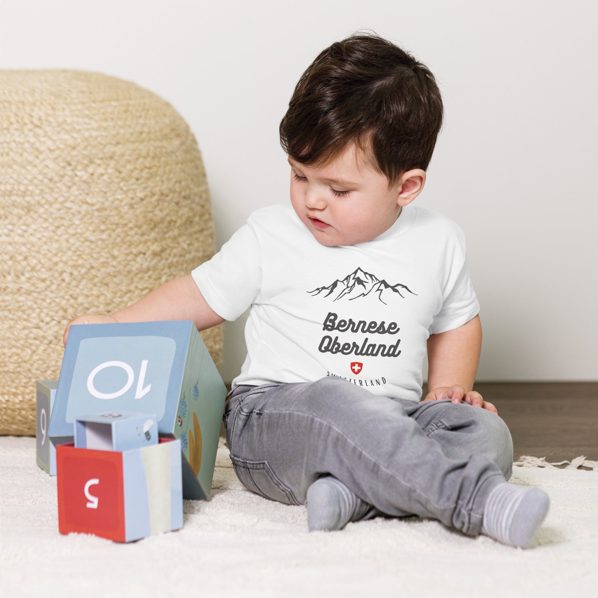 Infant model in Swiss Alps inspired baby t-shirt Bella Canvas 3001B