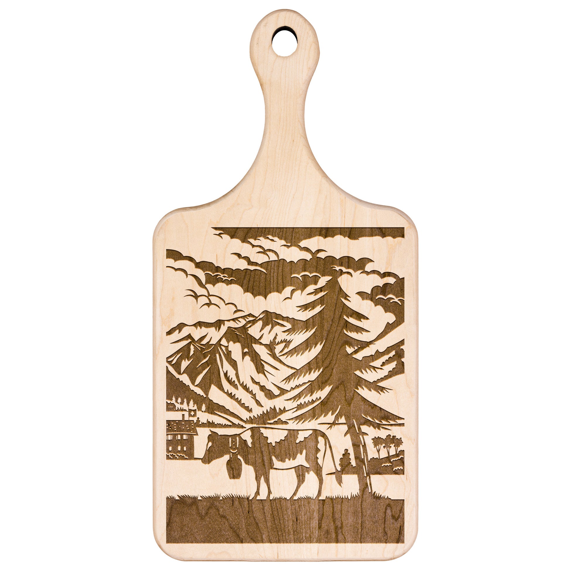 Scherenschnitte cutting board with Swiss cow silhouette against mountain backdrop