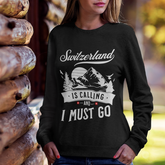 Adventurer wearing the Swiss-themed sweatshirt amidst a mountainous landscape