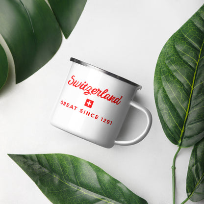A white enamel-style mug with a silver rim and handle, printed with red 'Switzerland' text, a small Swiss flag, and 'GREAT SINCE 1291' in red. 