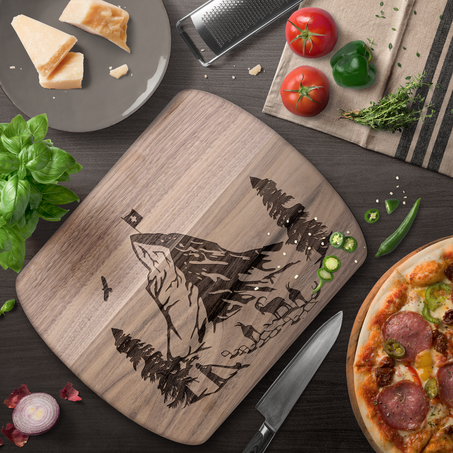 Matterhorn cutting board with Swiss Alps mountain silhouette design in dark wood, perfect for cheese and charcuterie serving