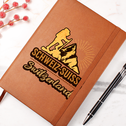 Brown Swiss journal featuring mountain climber and Switzerland typography