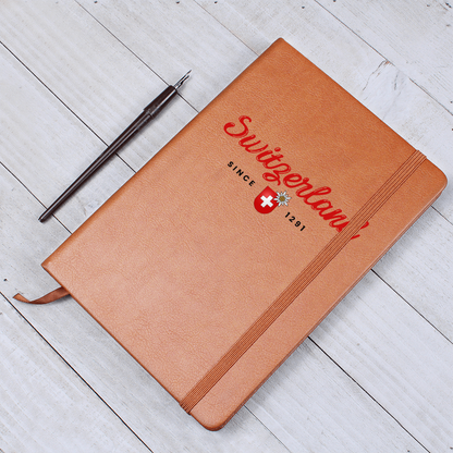 Swiss edelweiss and shield logo printed on a premium brown leather notebook