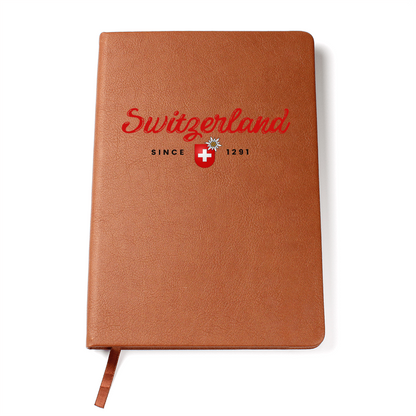 Tan leather Switzerland journal featuring red script and Swiss crest