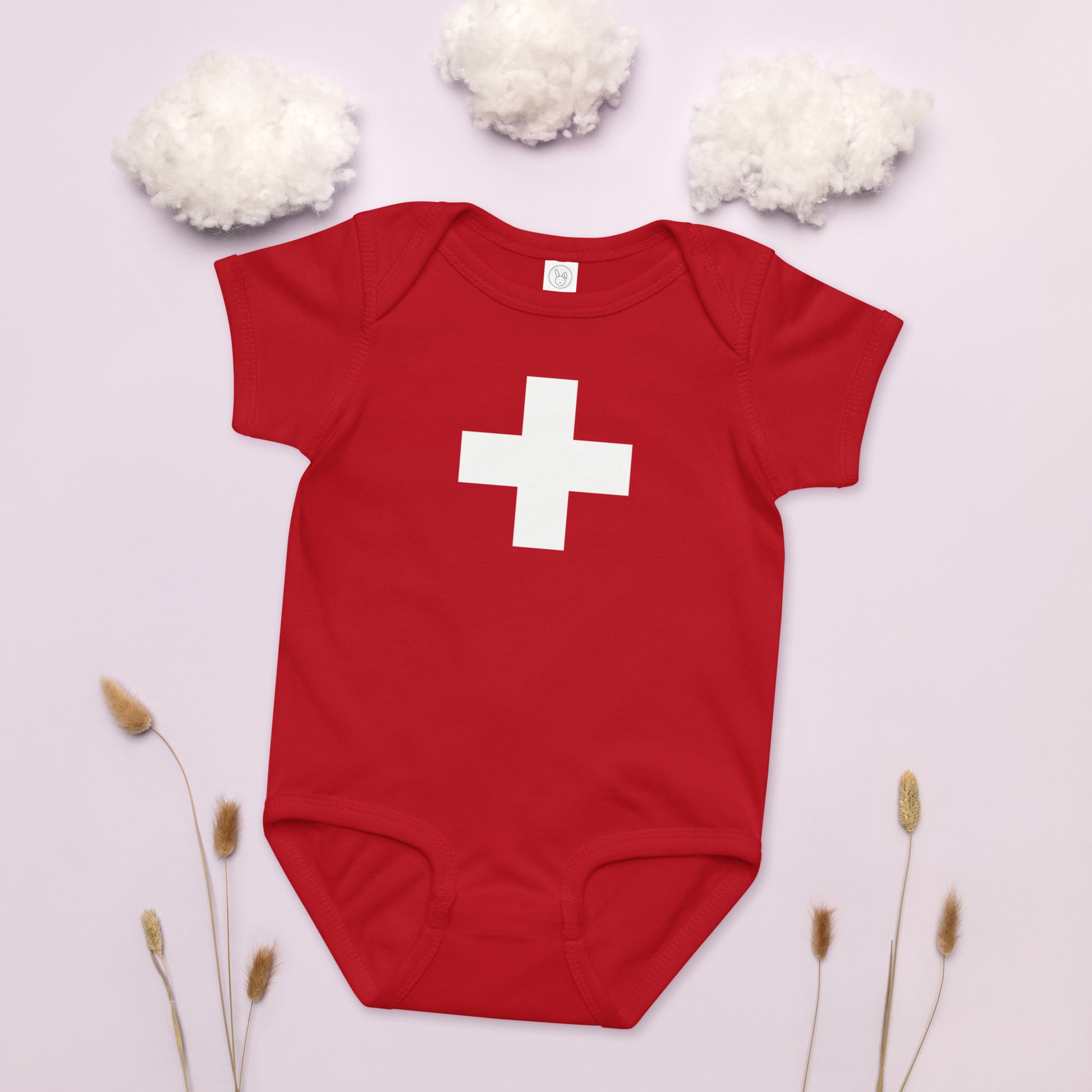 Infant onesie displaying Swiss national flag, gentle fabric perfect for delicate baby skin
