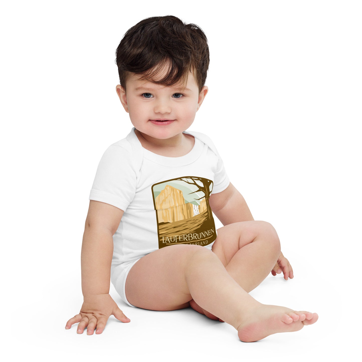  Travel-inspired baby clothing with Lauterbrunnen artwork in earth tones.