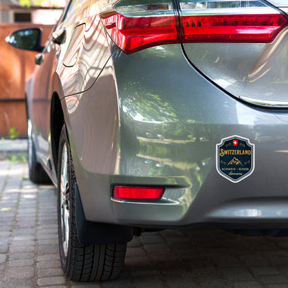 Swiss souvenir sticker featuring Alpine mountains and Switzerland emblem