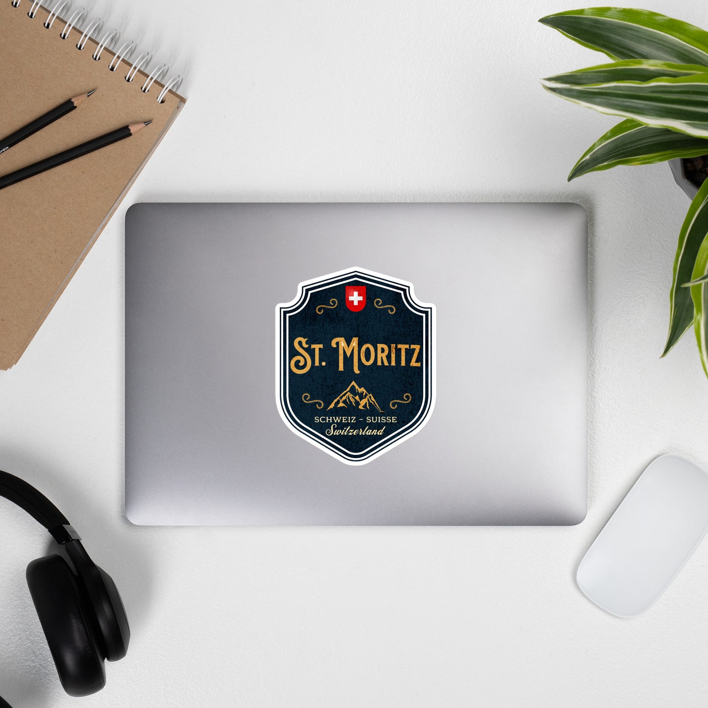 Vintage St. Moritz Switzerland decal for travelers with alpine badge and red Swiss cross