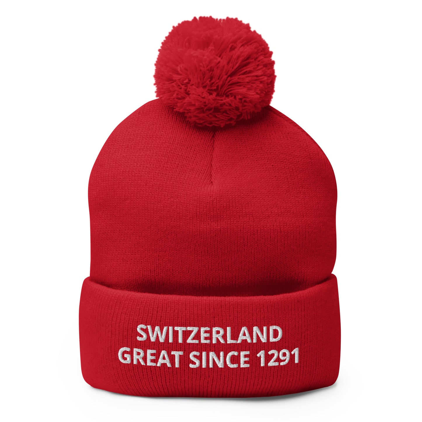 Front view of a red fold-over cuff beanie embroidered with “SWITZERLAND GREAT SINCE 1291”