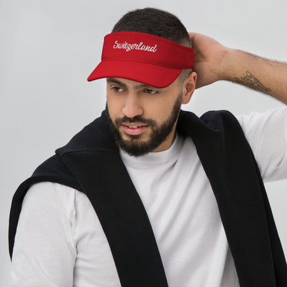 Man wearing a red visor with Switzerland embroidered souvenir visor cap — Swiss Alps gift idea