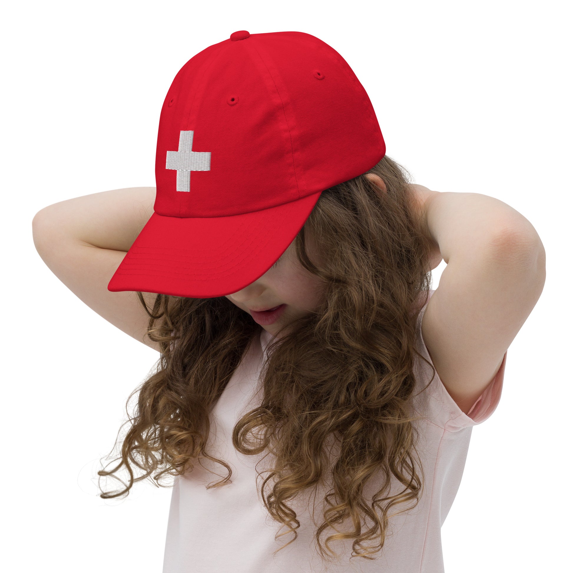 Youth baseball cap featuring Swiss flag, unstructured low-profile design with adjustable strap