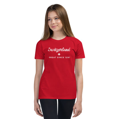 Girl wearing red Switzerland Great Since 1291 youth t-shirt with Swiss cross design – front view